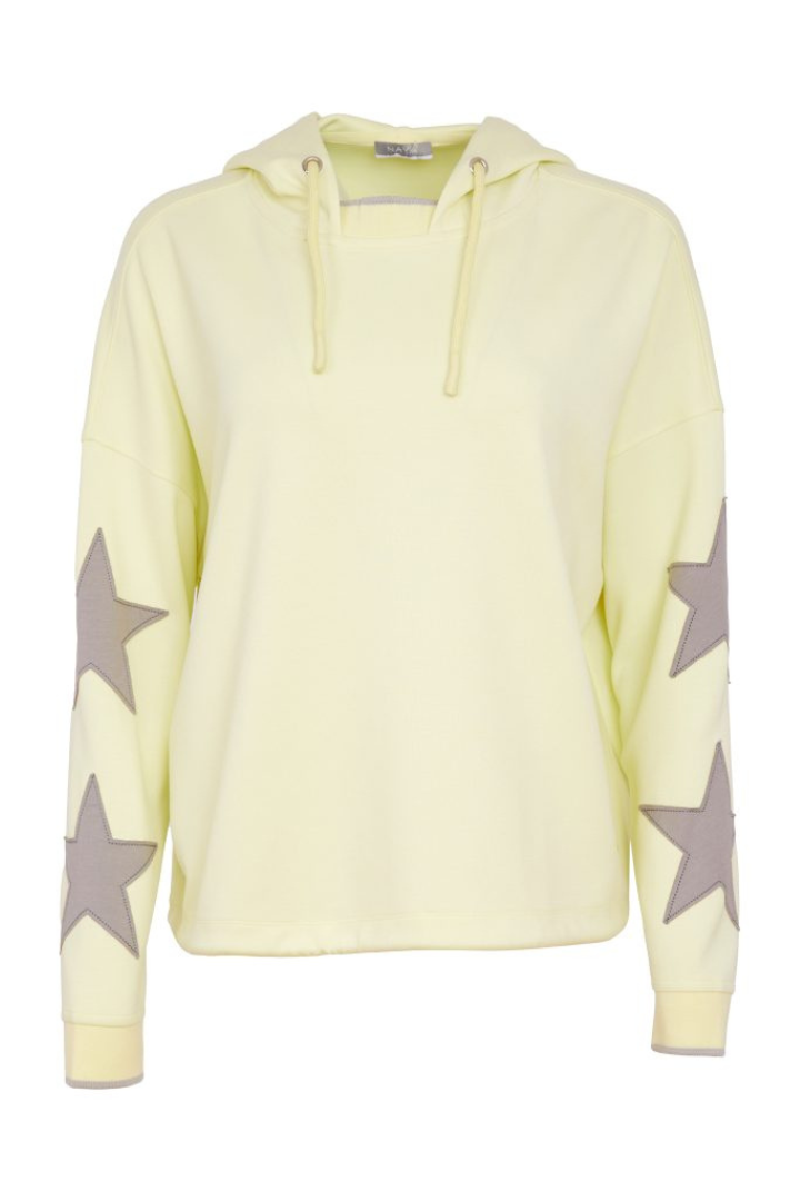 Light yellow hoodie with star patterns on sleeves against a white background