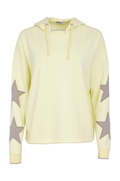 Light yellow hoodie with star patterns on sleeves against a white background